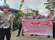 Meriahkan HUT KEMRI, Satlantas Polres Nias Bagikan Bendera Dan Stiker Merah Putih
