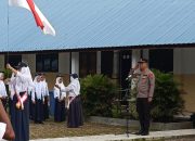 Pimpin Upacara Di SMPN 9 Sei Raja Kapolsek Sei Tulang Raso Go To School