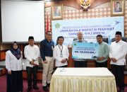 Kemenag RI dan Garuda Indonesia Serahkan Santunan Ekstra Cover ke Ahli Waris Jemaah