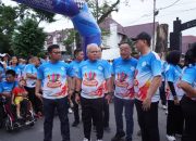 Harli Siregar bersama PJU Kejatisu Berbaur bersama Masyarakat di Jalan Amal Bersama Yayasan Thongs Berkah Mulia Abadi
